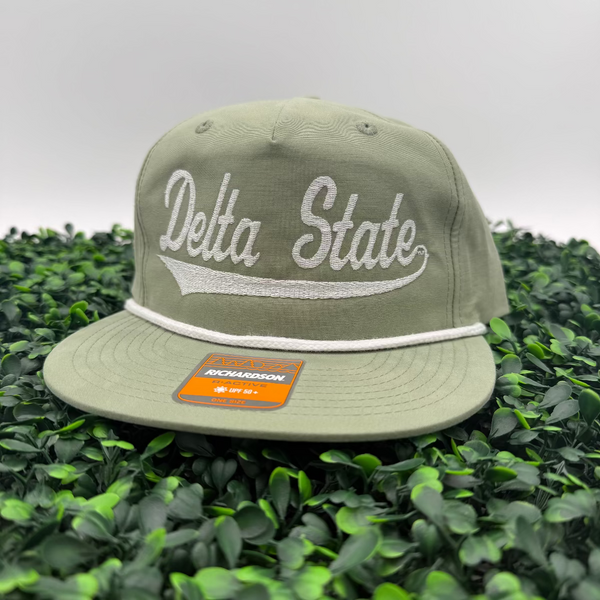 Green cap with 'Delta State' text on a green leaf background